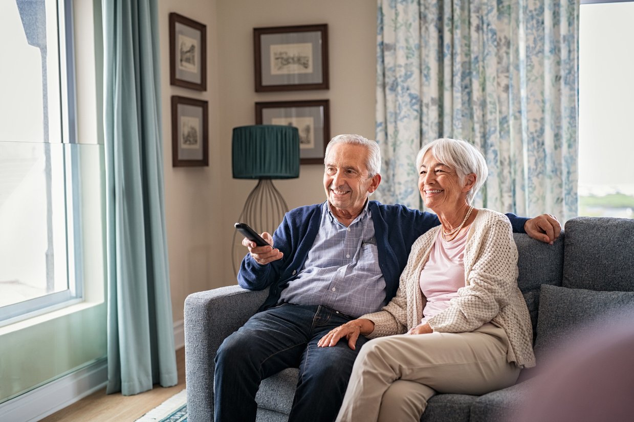 Old Couple Watching TV at Home