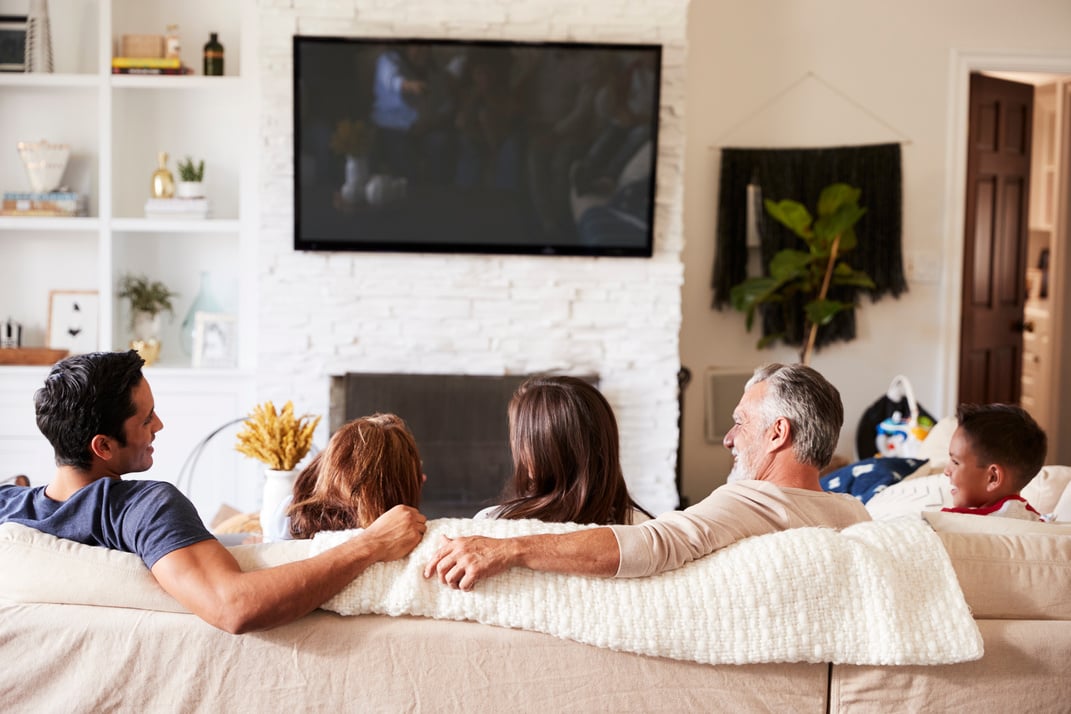 Family Watching TV at Home